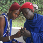 Maasai Moran (Warriors) learn to use the digital camera for photovoice research.