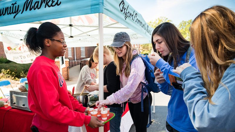 students sample offerings from the Oxford Community Market at the Sustainability Fair during the 2018 Green Week observance. Photo by Megan Wolfe